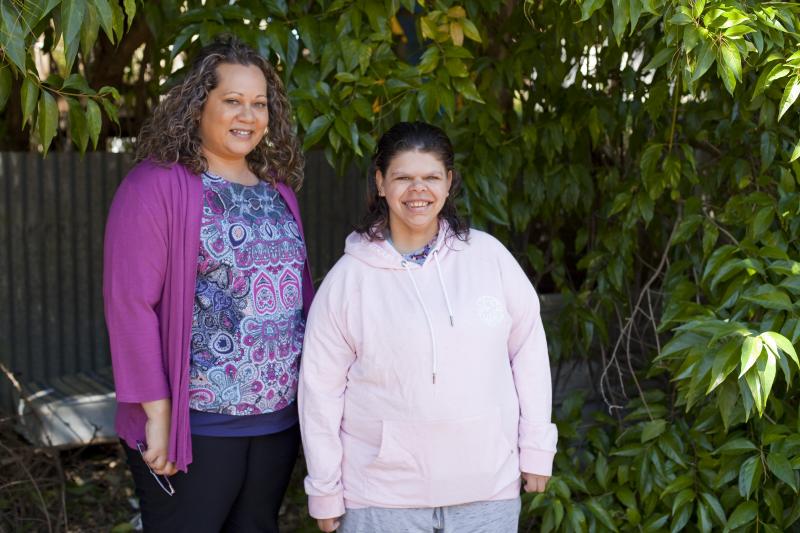 Two women smiling at the camera